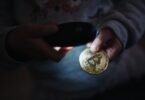 Physical bitcoin tokens arranged on a dark surface