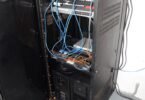 network cables in a blue-lit server room