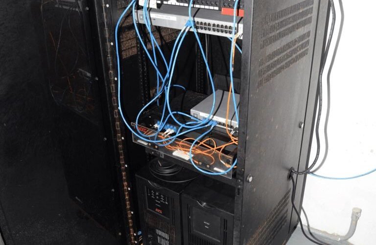 network cables in a blue-lit server room