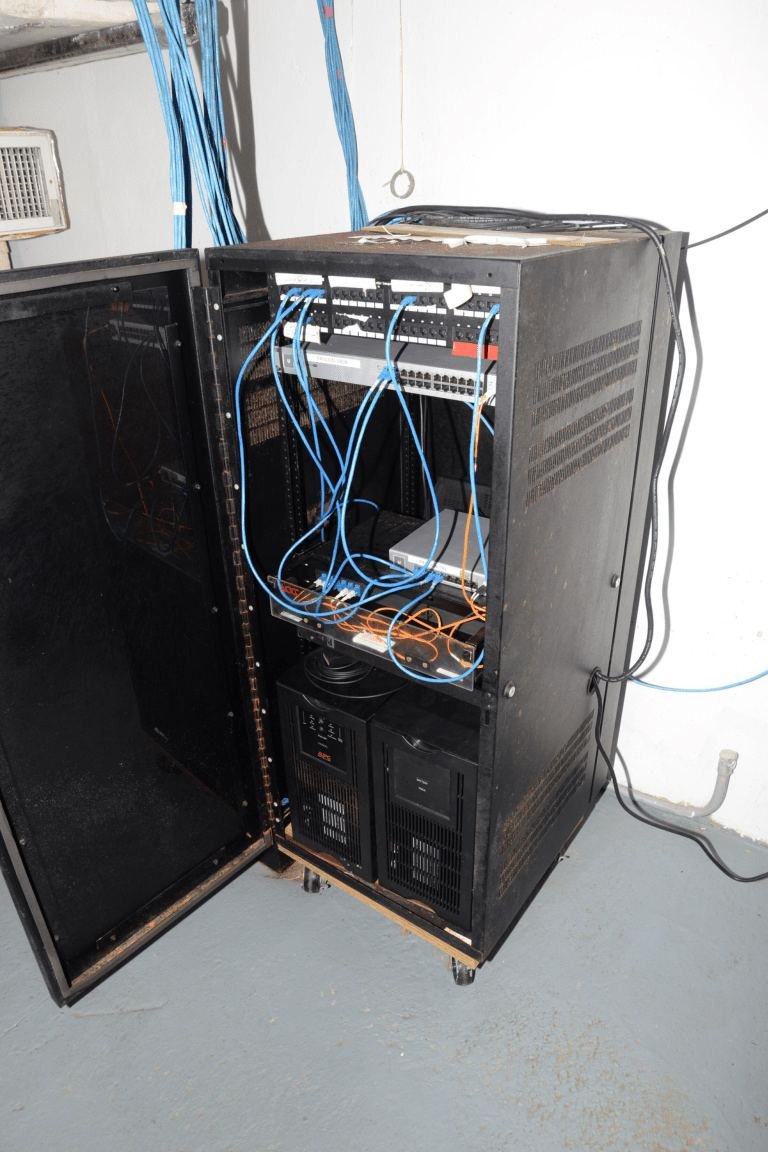 network cables in a blue-lit server room